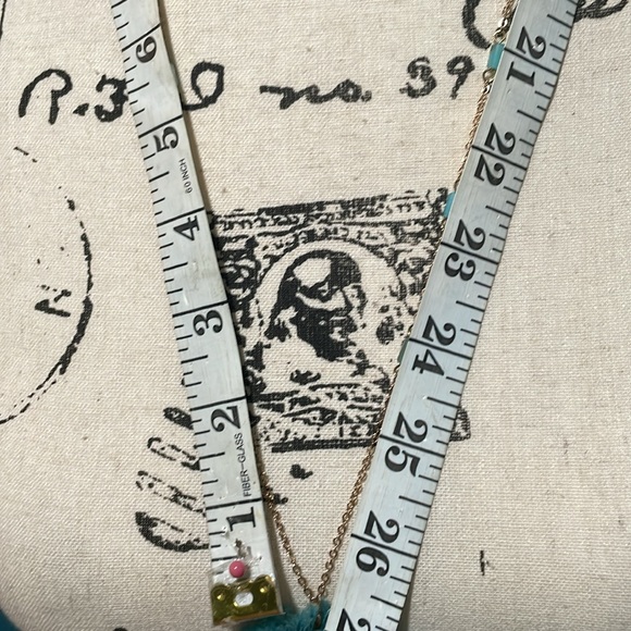 Light gold necklace with round teal threaded pendant, small long beads on chain - Picture 5 of 8